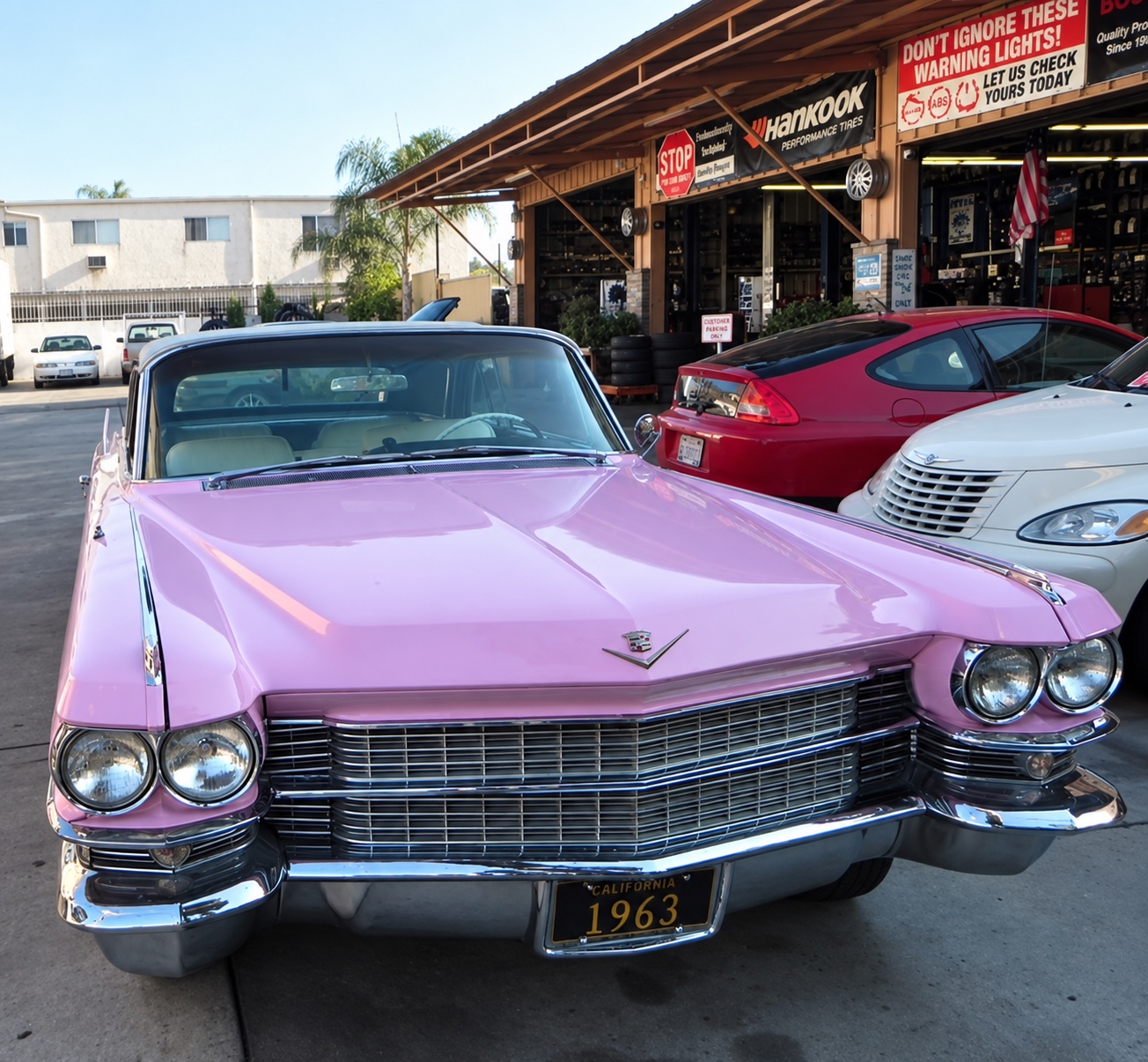 Pink Cadillac outside Speedy Lane Automotive