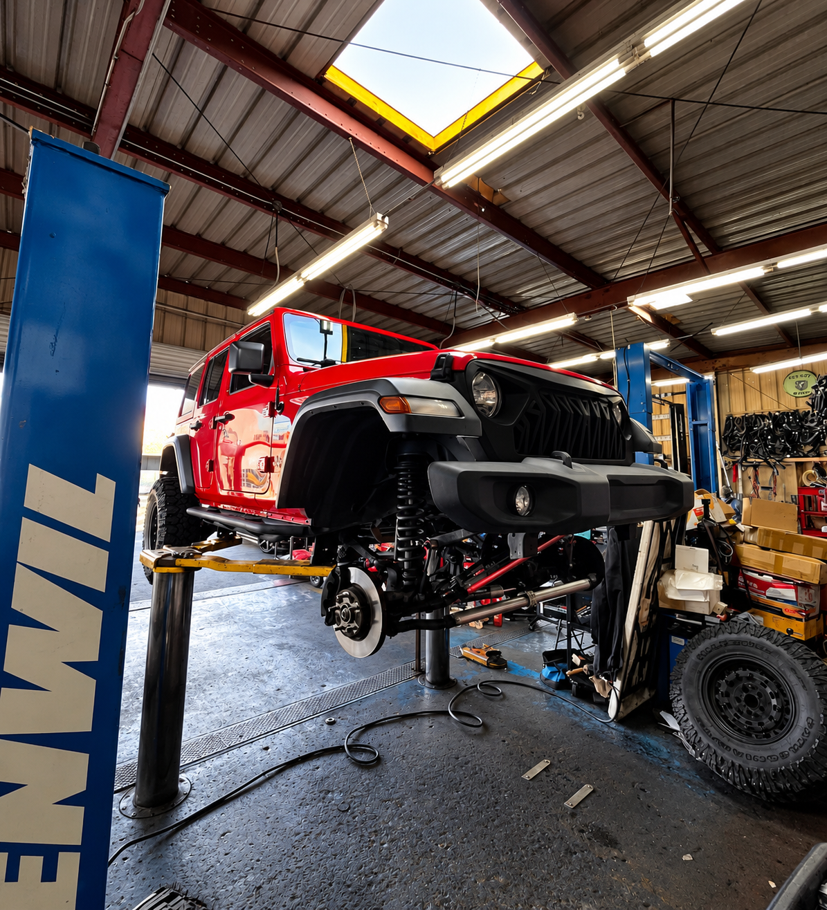 Red Jeep being serviced at Speedy Lane